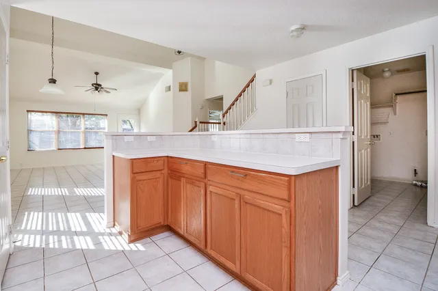 a view of an empty room and wooden floor