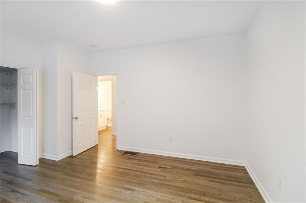 1070 4th Street Northwest Atlanta, GA 30318 - Photo 17 of 21 a view of an empty room and wooden floor