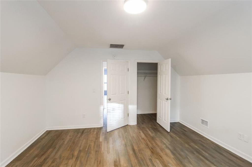 1070 4th Street Northwest Atlanta, GA 30318 - Photo 19 of 21 a view of wooden floor and windows in a room