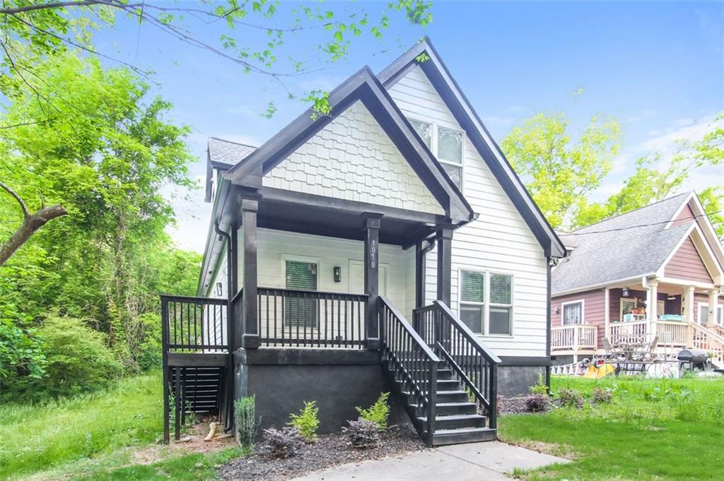 1070 4th Street Northwest Atlanta, GA 30318 - Photo 2 of 21 a front view of a house with a yard