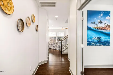 a living room with furniture large window and a fireplace