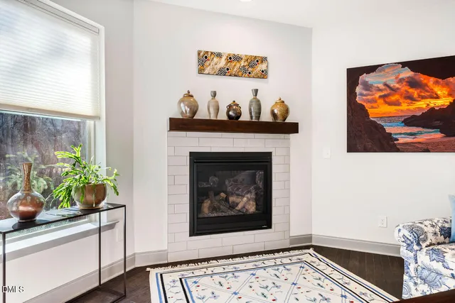 a kitchen with a sink a center island a counter space and stainless steel appliances