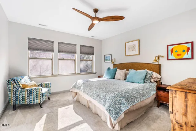 a bathroom with a double vanity sink a mirror and a shower