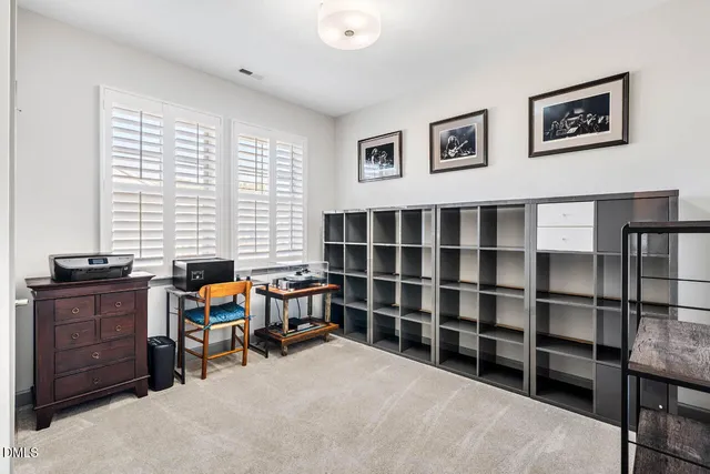 a view of a small space with wooden floor