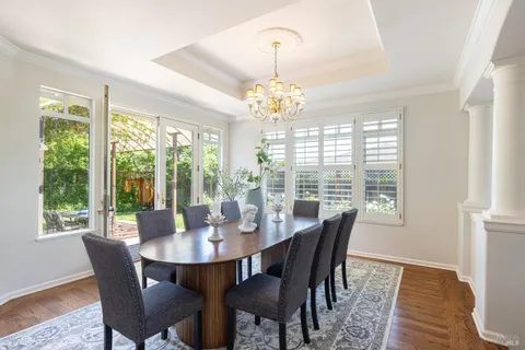 a view of a dining room with furniture window and outside view