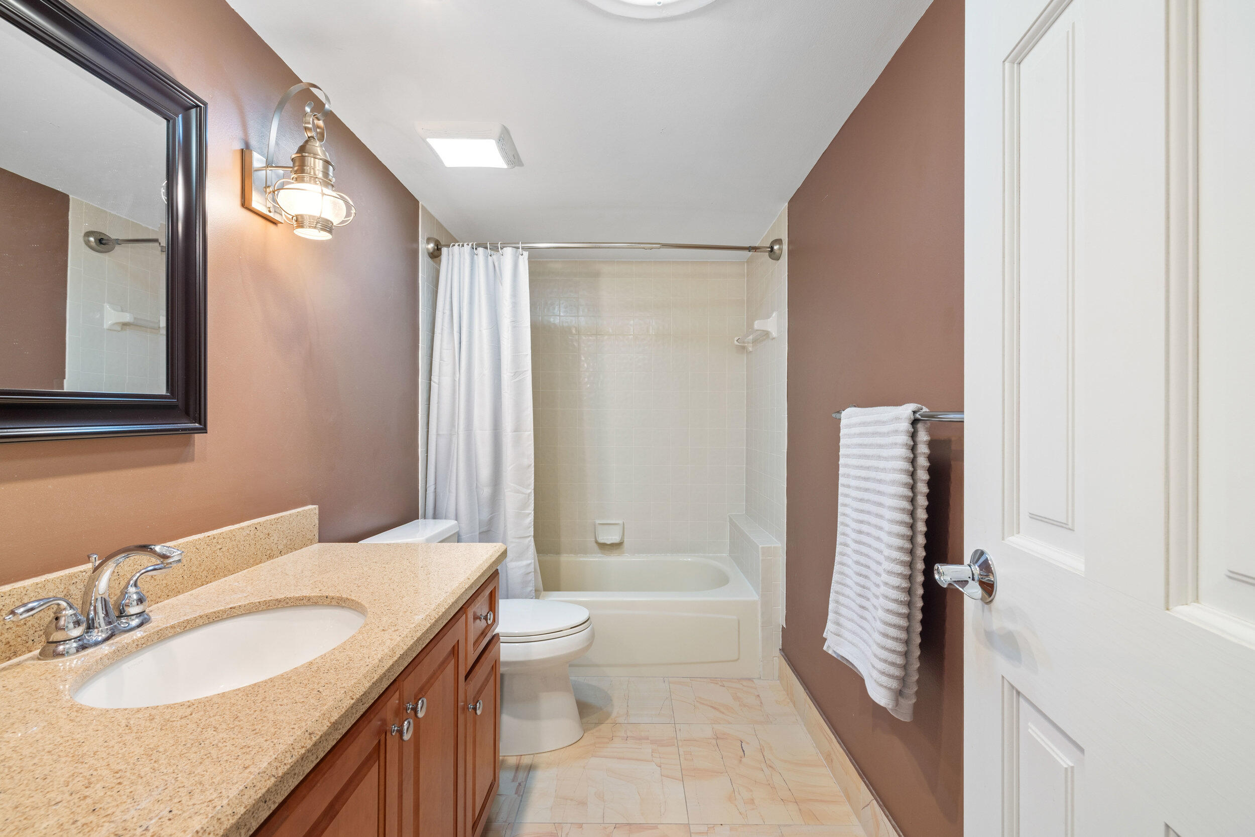 3501 Harbor Circle Delray Beach, FL 33483 - Photo 13 of 25 a bathroom with a granite countertop sink toilet and shower