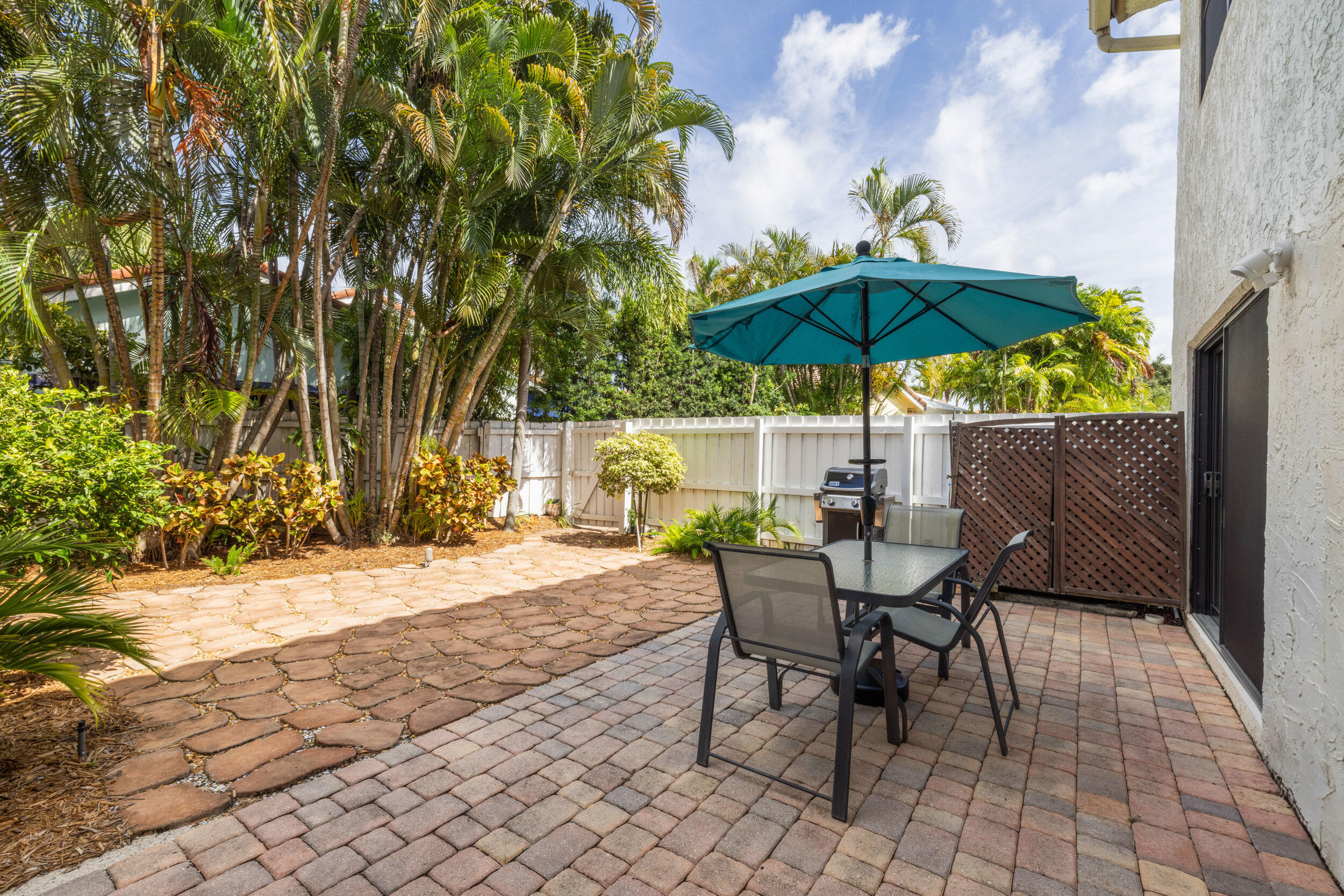 3501 Harbor Circle Delray Beach, FL 33483 - Photo 15 of 25 a view of backyard with seating space and trees