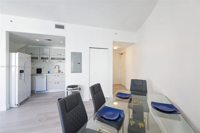 a view of kitchen and dining area with furniture