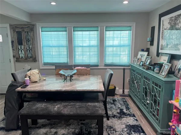 a view of a dining room with furniture window and outside view