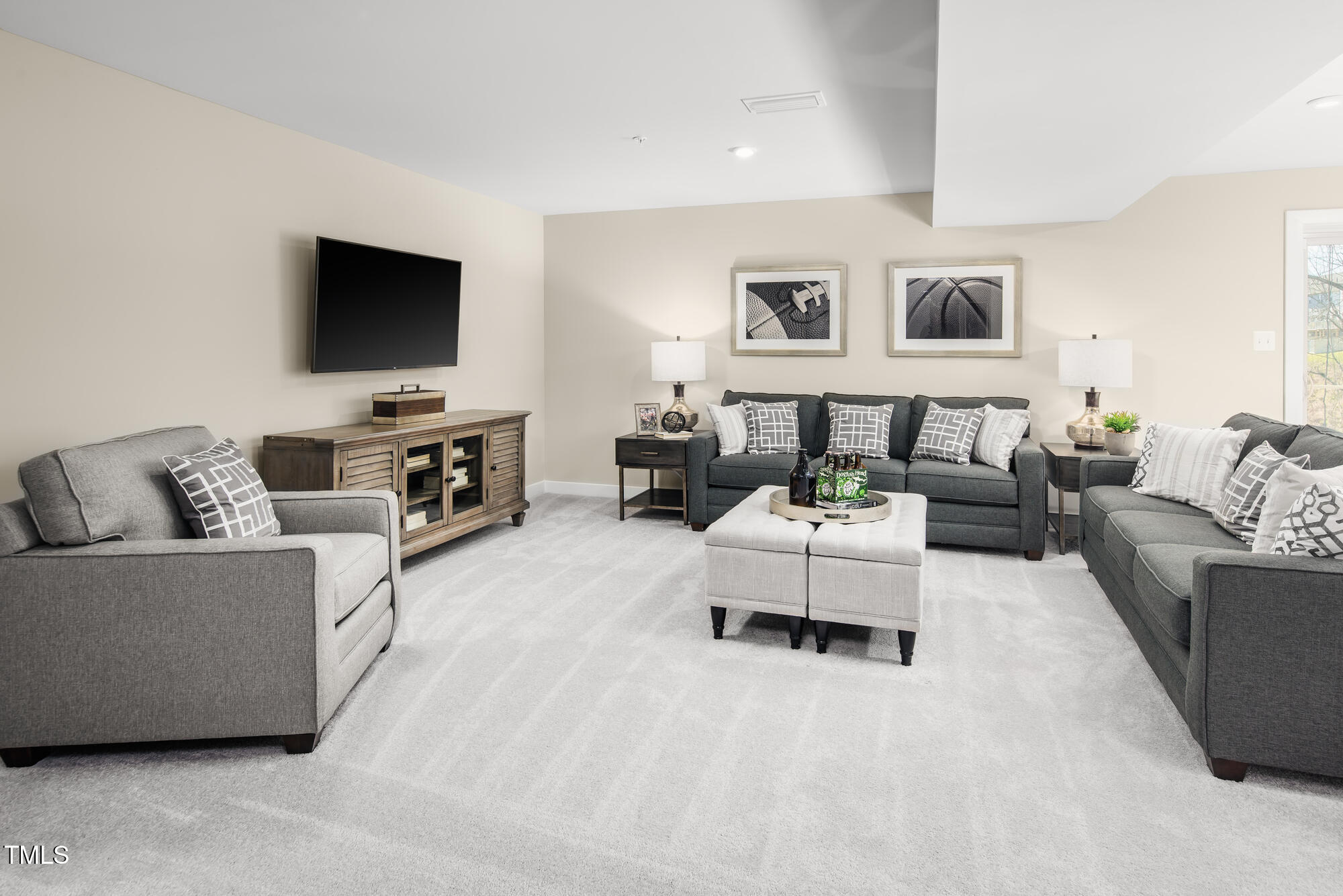 565 Freedom Trail Drive Willow Spring, NC 27592 - Photo 22 of 25 a living room with furniture and a flat screen tv