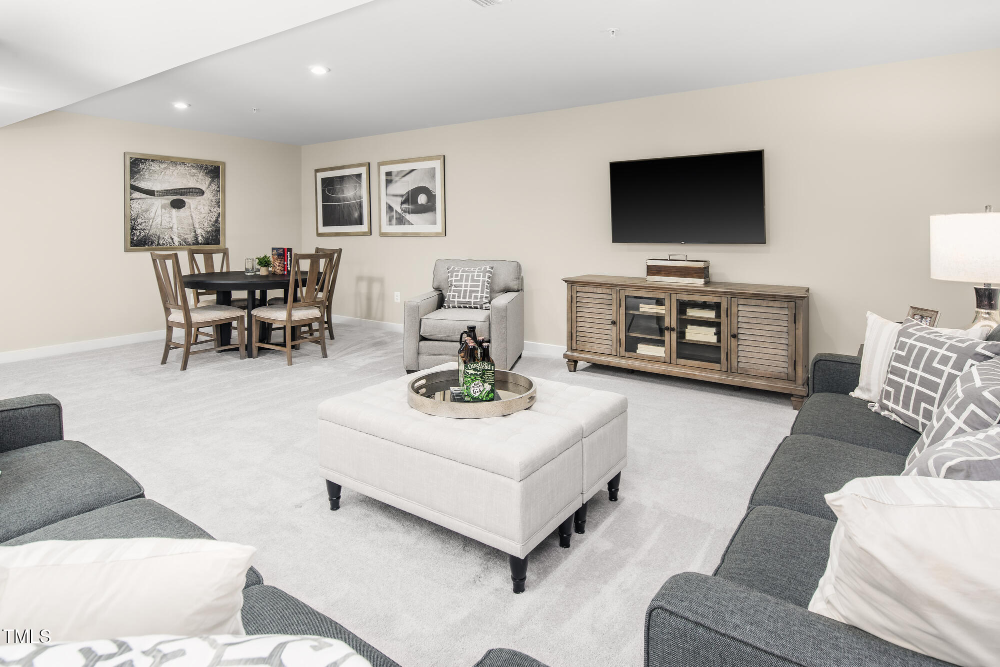 565 Freedom Trail Drive Willow Spring, NC 27592 - Photo 23 of 25 a living room with furniture and a flat screen tv
