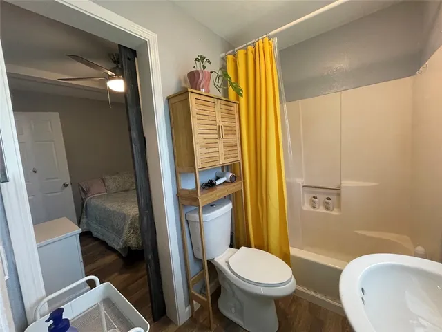 a bedroom with bed and window