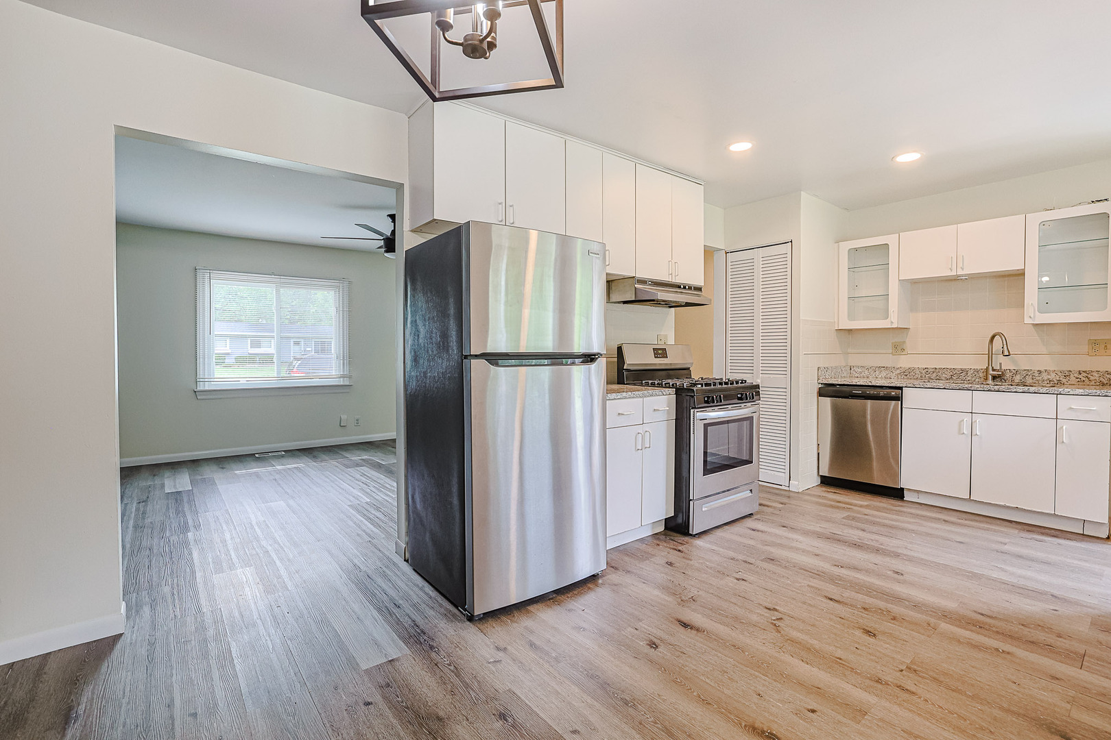 63 Sierra Road Montgomery, IL 60538 - Photo 11 of 22 a kitchen with stainless steel appliances a refrigerator sink and cabinets