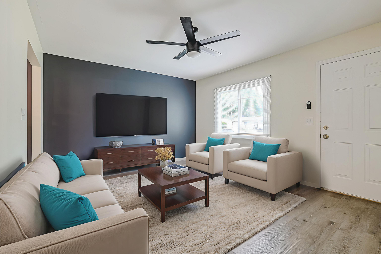 63 Sierra Road Montgomery, IL 60538 - Photo 6 of 22 a living room with furniture and a flat screen tv