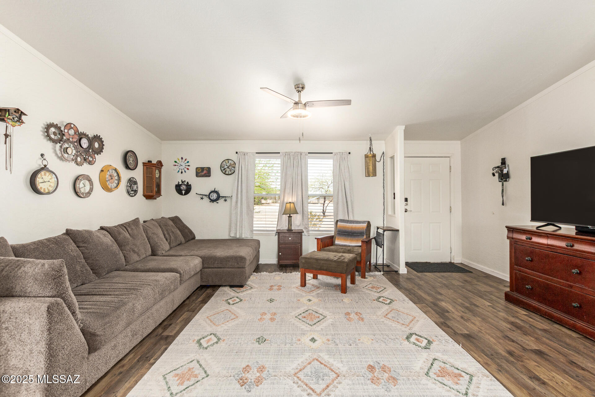 5386 North Whitetail Road Marana, AZ 85653 - Photo 7 of 33 a living room with furniture and a flat screen tv