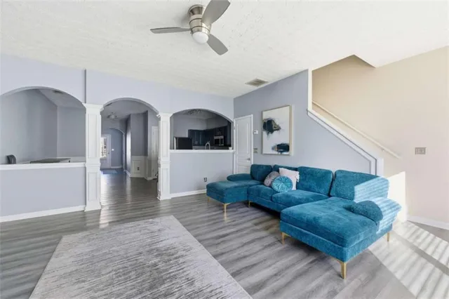 a living room with furniture and a fireplace