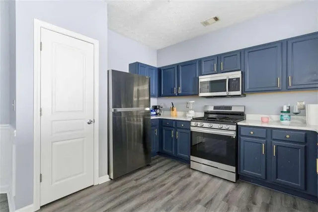 a spacious bathroom with a double vanity sink and a mirror