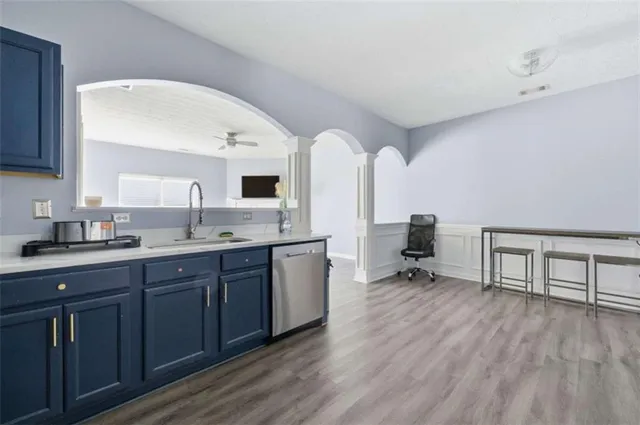 a kitchen with stainless steel appliances granite countertop a refrigerator stove and sink