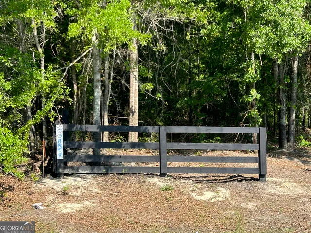 a view of backyard with sitting area
