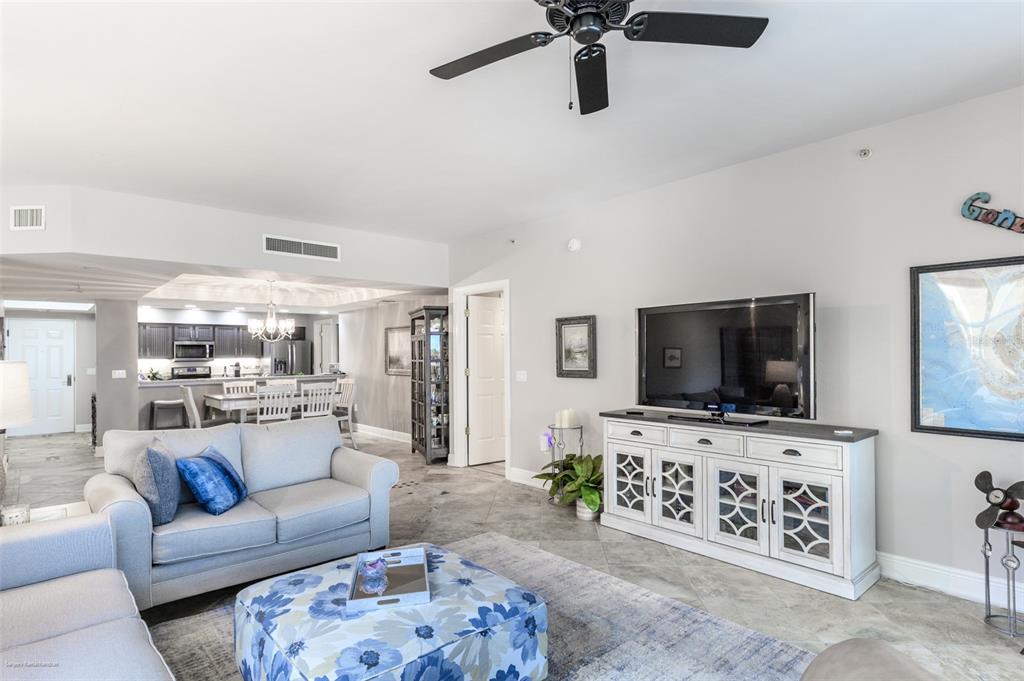 3313 Sunset Key Circle, Unit 107 Punta Gorda, FL 33955 - Photo 34 of 58 a living room with furniture and a flat screen tv