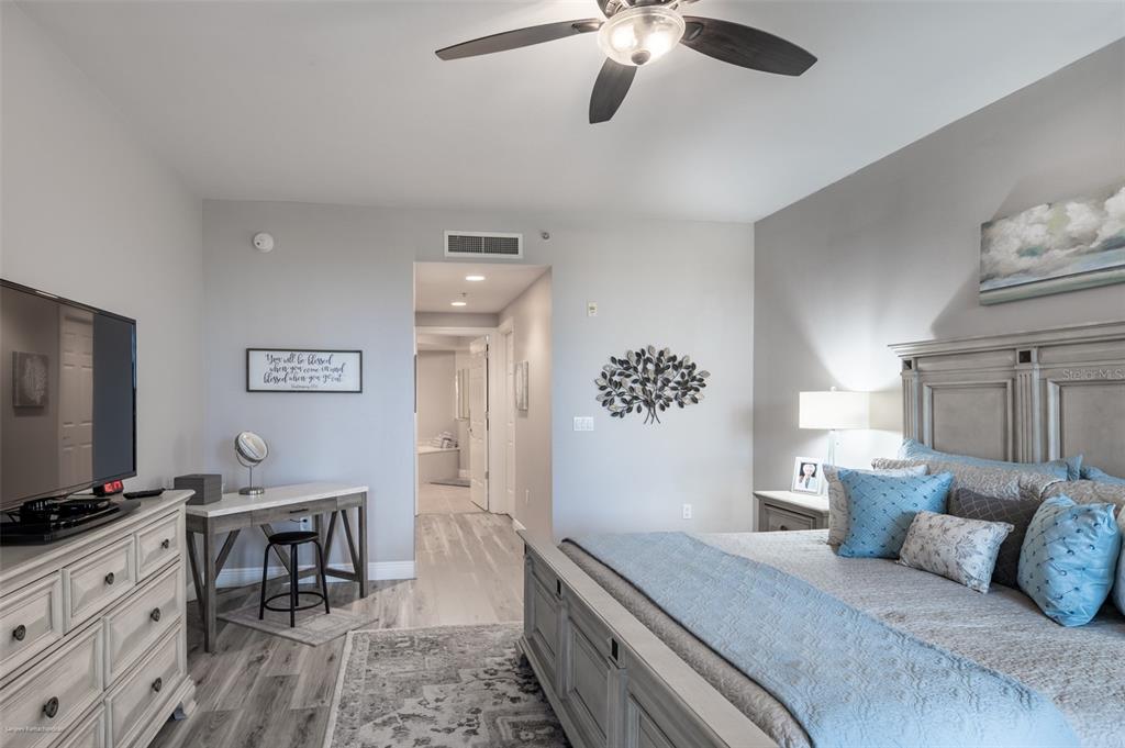 3313 Sunset Key Circle, Unit 107 Punta Gorda, FL 33955 - Photo 37 of 58 a bedroom with a bed and a flat screen tv