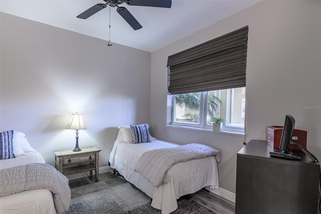 3313 Sunset Key Circle, Unit 107 Punta Gorda, FL 33955 - Photo 45 of 58 a bedroom with a bed and a table