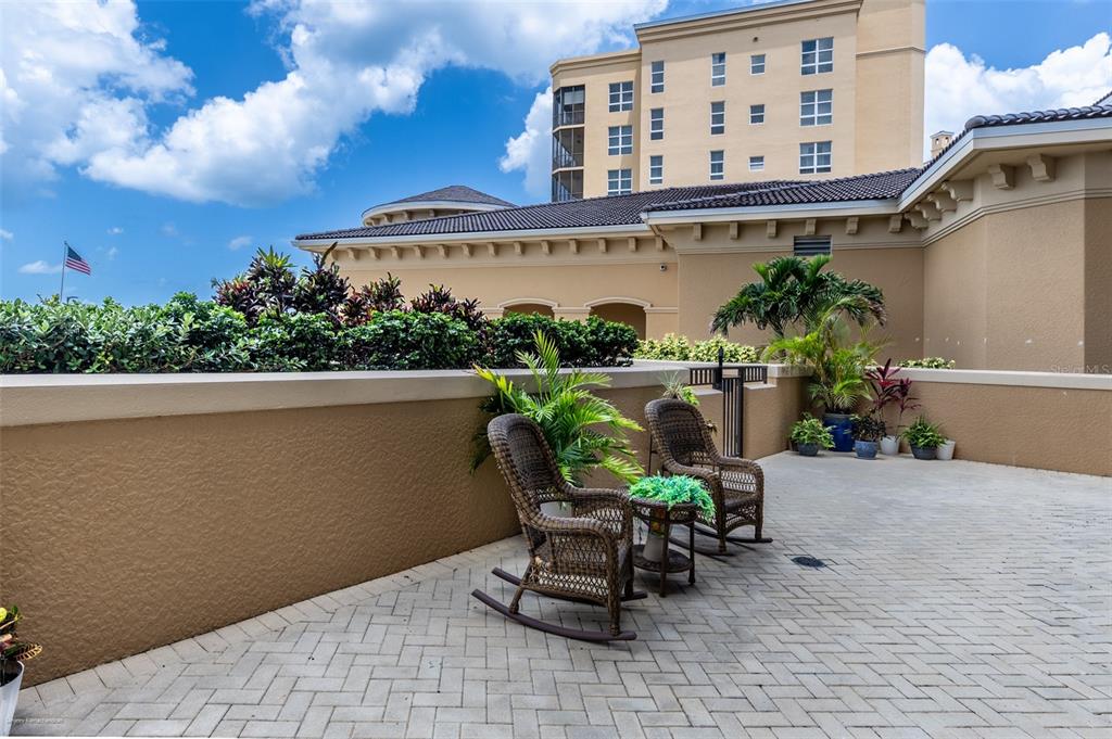 3313 Sunset Key Circle, Unit 107 Punta Gorda, FL 33955 - Photo 49 of 58 a view of a patio with a table and chairs