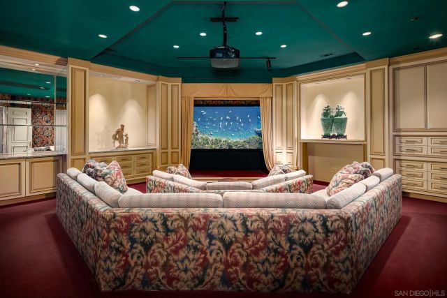 a en suite bathroom with a granite countertop sink and a mirror