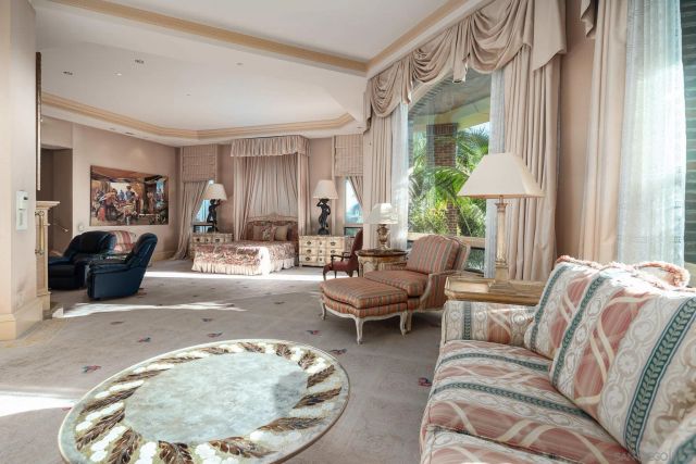 a view of spacious bathroom with a tub shower and mirror
