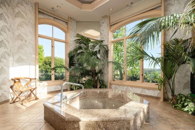 a view of a hallway with wooden floor and bedroom