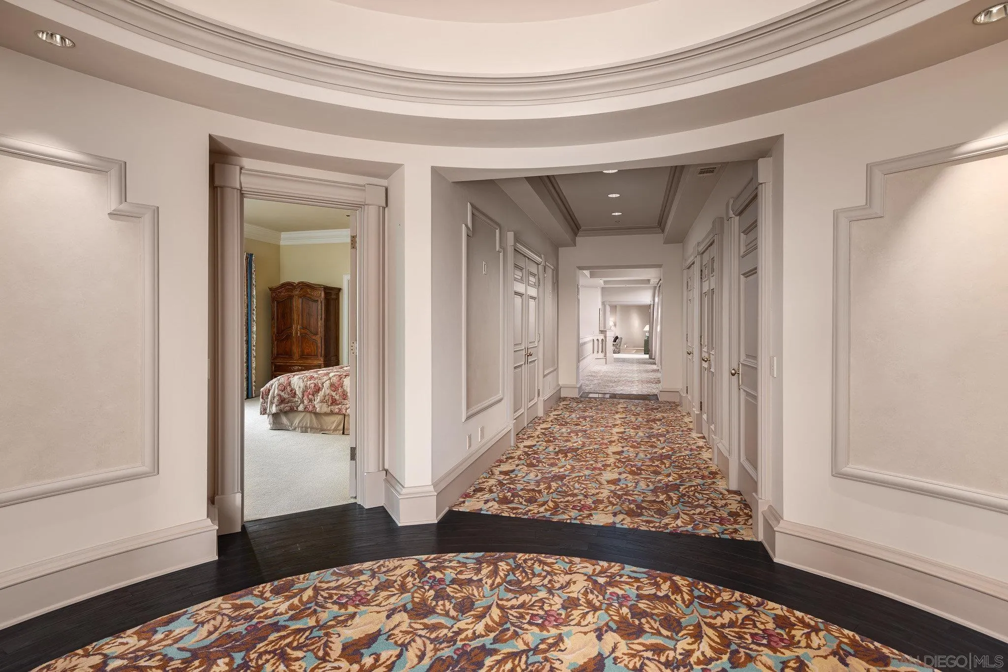 5893 Winland Hills Drive Rancho Santa Fe, CA 92067 - Photo 23 of 41 a view of a hallway with wooden floor and bedroom