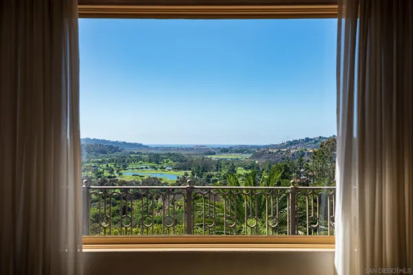 a view of a lake with a house in the background