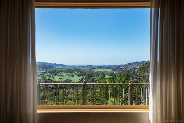 a view of a lake with a house in the background