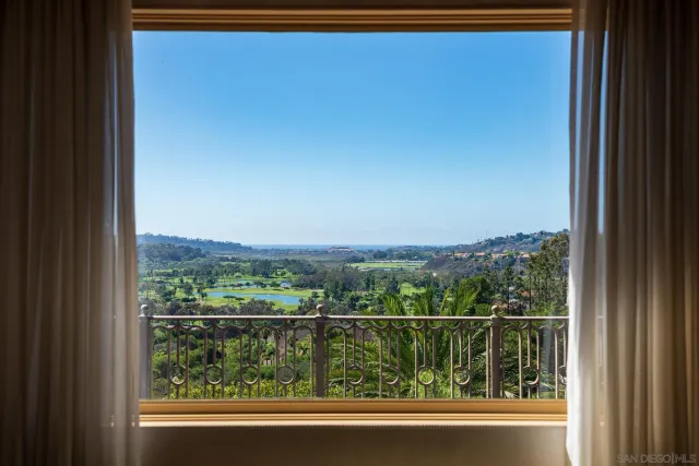 a view of a lake with a house in the background