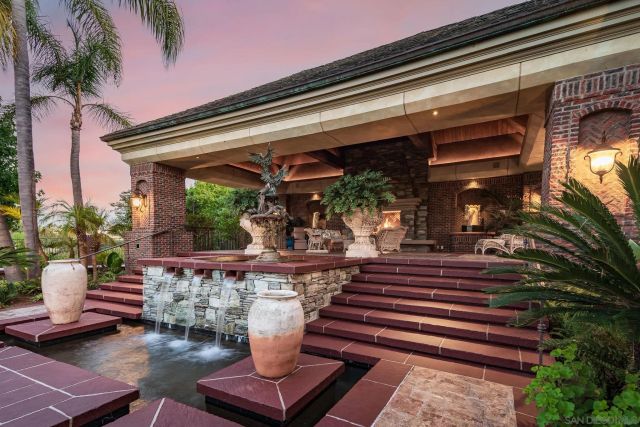 a view of a patio with table and chairs and wooden floor