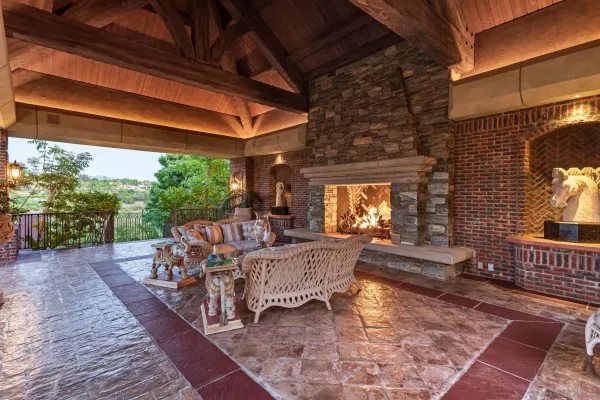 a view of a swimming pool with a table and chairs
