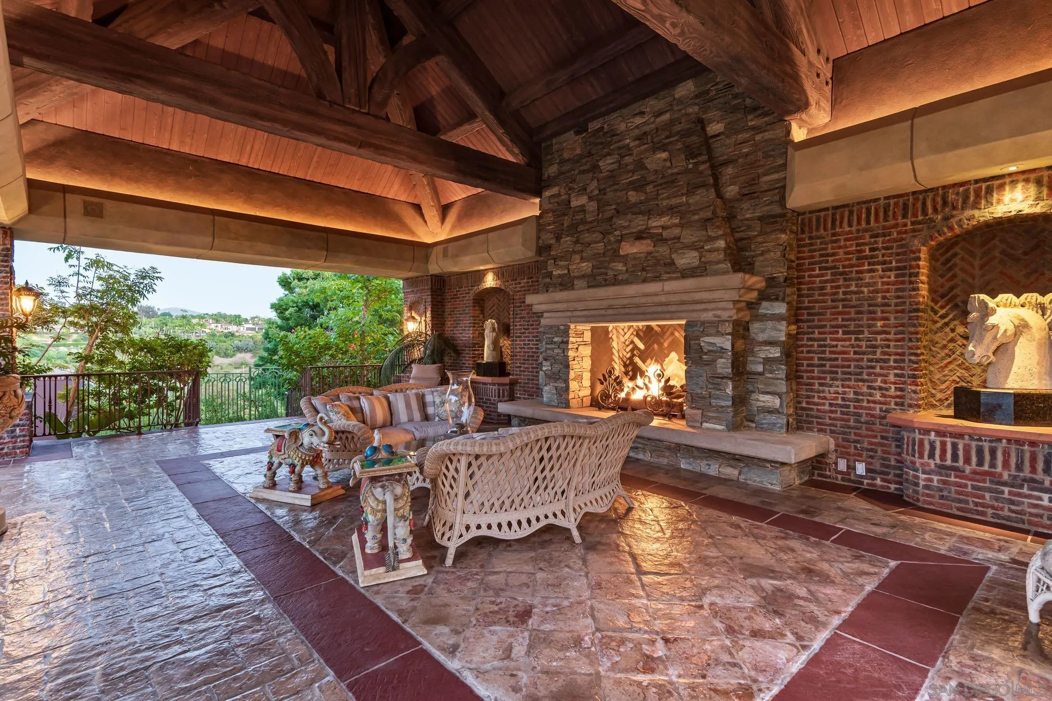 5893 Winland Hills Drive Rancho Santa Fe, CA 92067 - Photo 29 of 41 a view of a patio with table and chairs and wooden floor