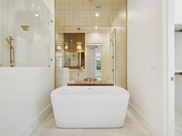 a white bath tub sitting in a bathroom