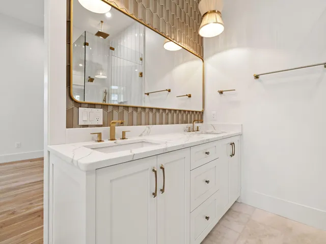 a bathroom with a sink vanity and a mirror