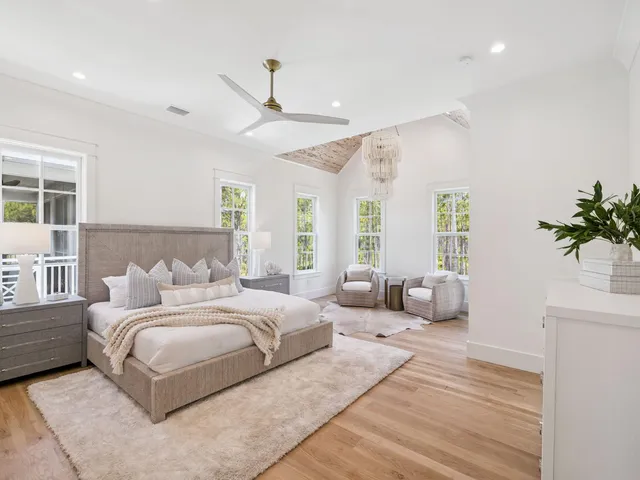 a bedroom with a large bed and a couch