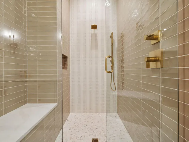 a bathroom with a bathtub and a shower