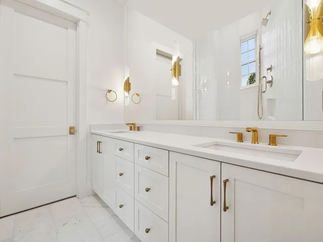 a bathroom with a sink a vanity and a mirror