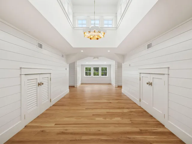 a view of an entryway with wooden floor