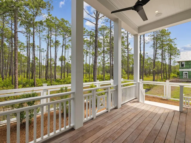 a view of porch with wooden floor and roof