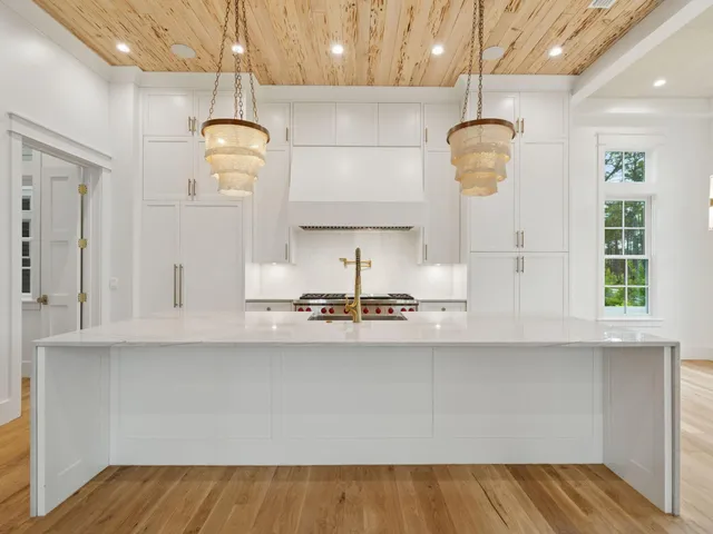 a kitchen with stainless steel appliances a sink and a stove