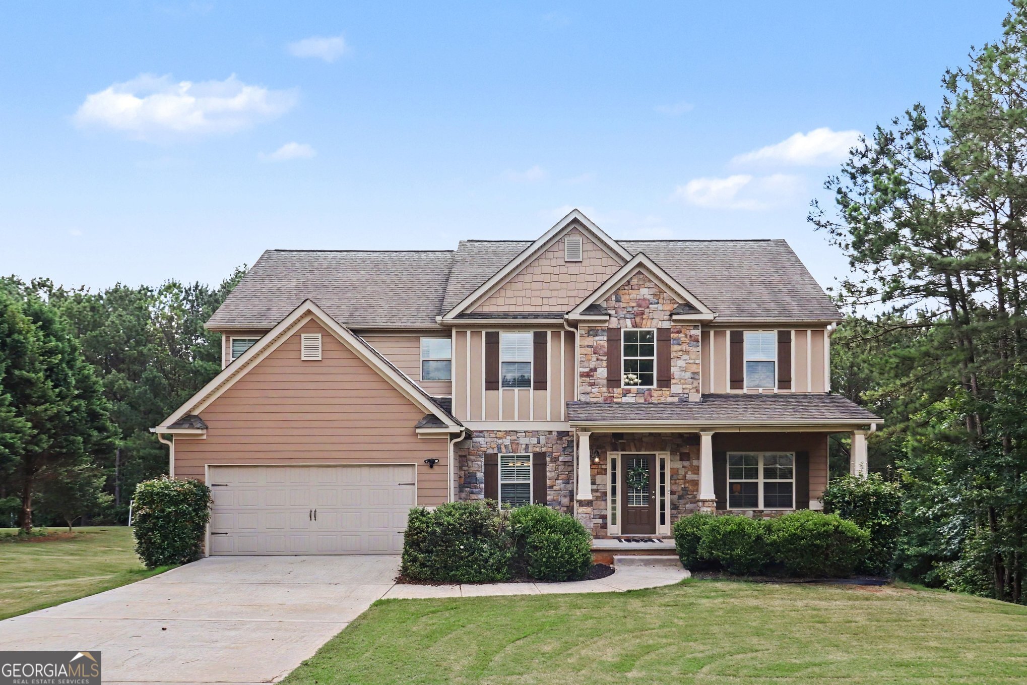 207 George Wynn Road Palmetto, GA 30268 - Photo 1 of 32 a front view of a house with garden