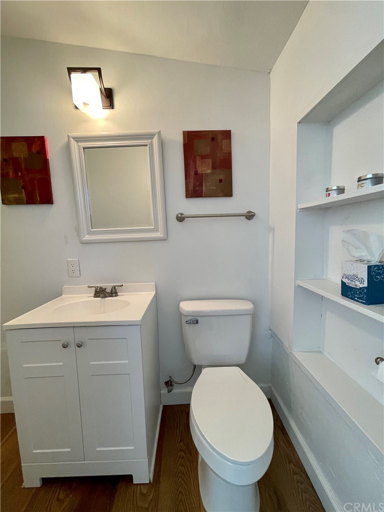 416 Aster Street Laguna Beach, CA 92651 - Photo 13 of 14 a bathroom with a toilet sink and mirror