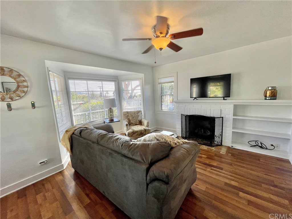 416 Aster Street Laguna Beach, CA 92651 - Photo 2 of 14 a living room with furniture fireplace and a flat screen tv