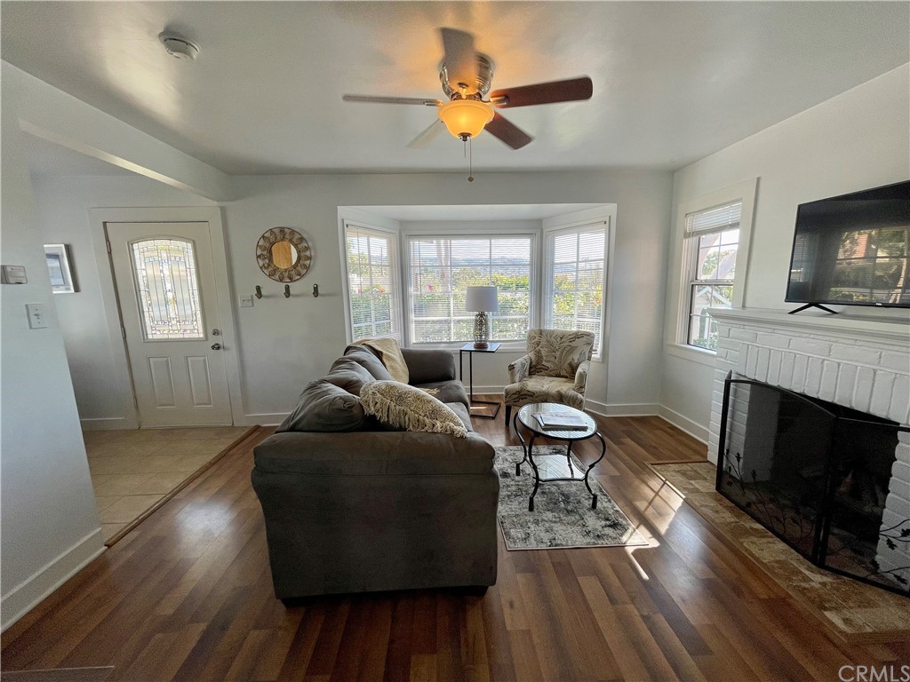 416 Aster Street Laguna Beach, CA 92651 - Photo 9 of 14 a living room with furniture a fireplace and a flat screen tv
