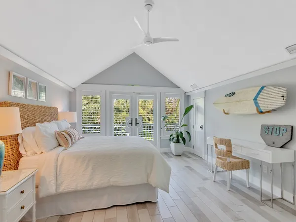 a bedroom with a large bed and a large window